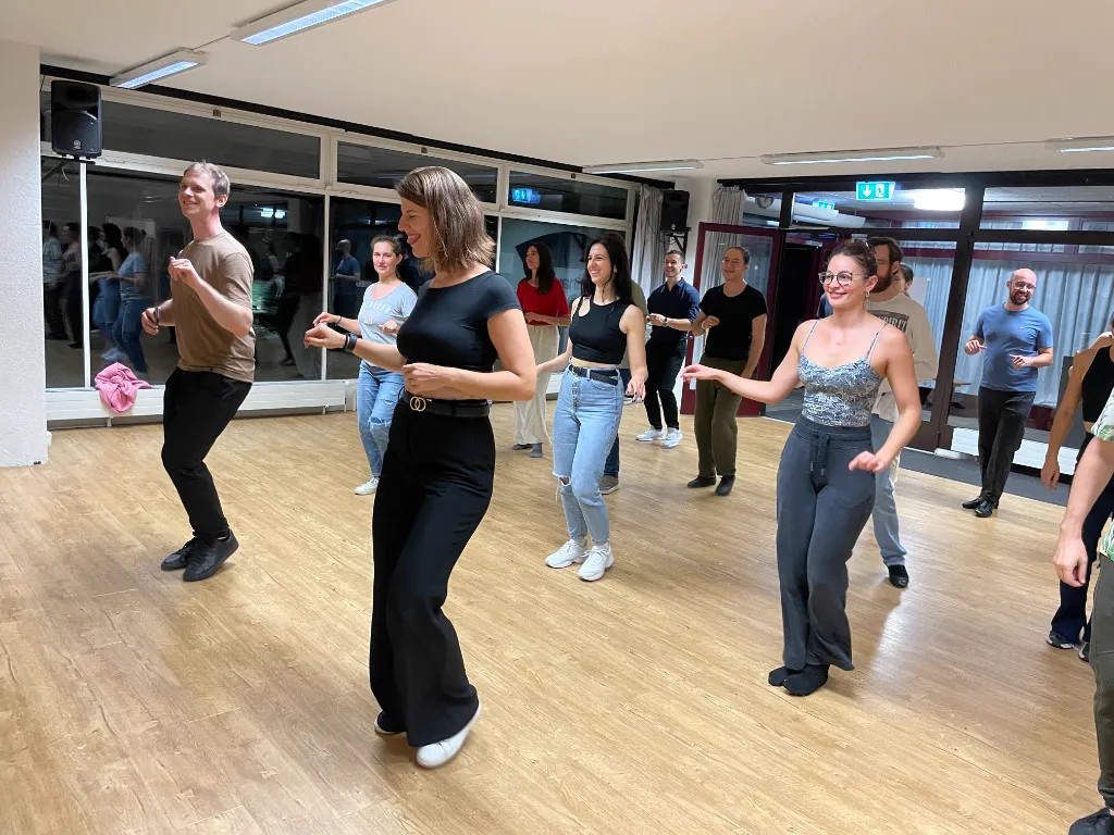 Action shot of a fun moment during a couples dance class