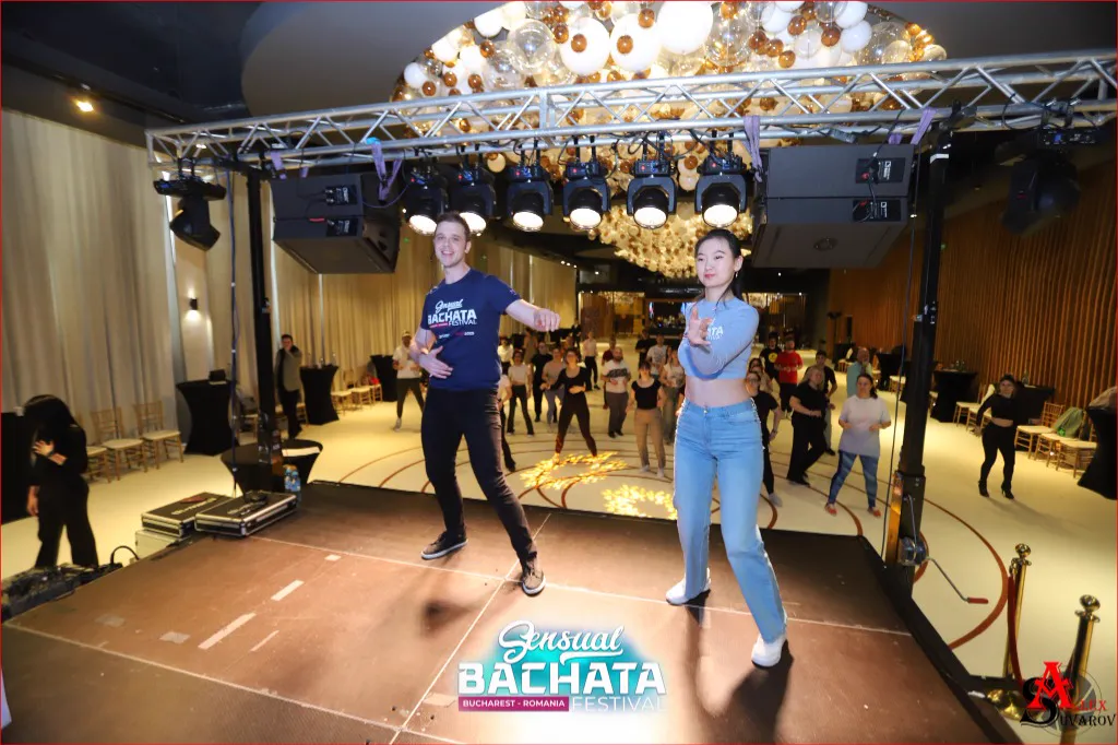 Ale and Xidan performing on stage at a festival