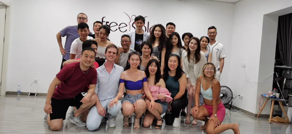 Group of smiling dancers after a successful intensive session