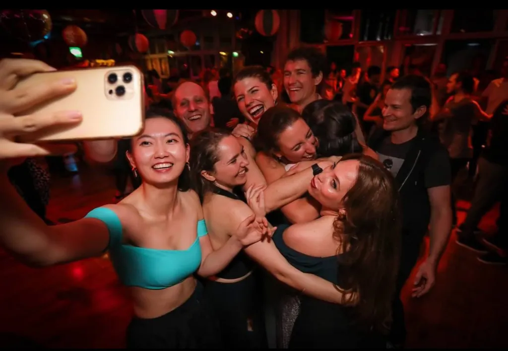 Group selfie at dance event
